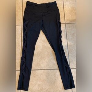 Black Workout Leggings Size: Small. Mesh and Crisscross on the Sides